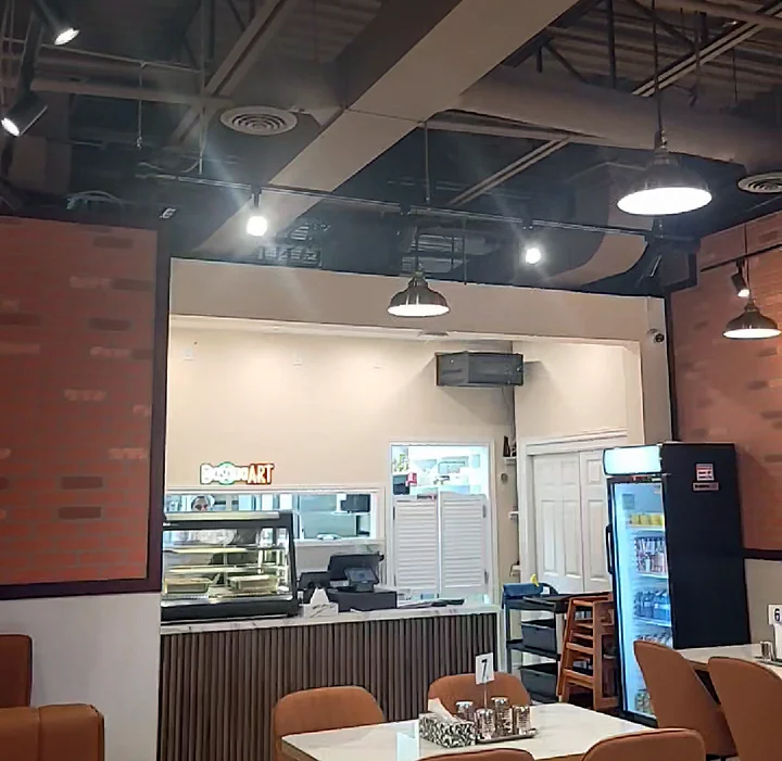 DosaaaART dining room with tan chairs and the open counter